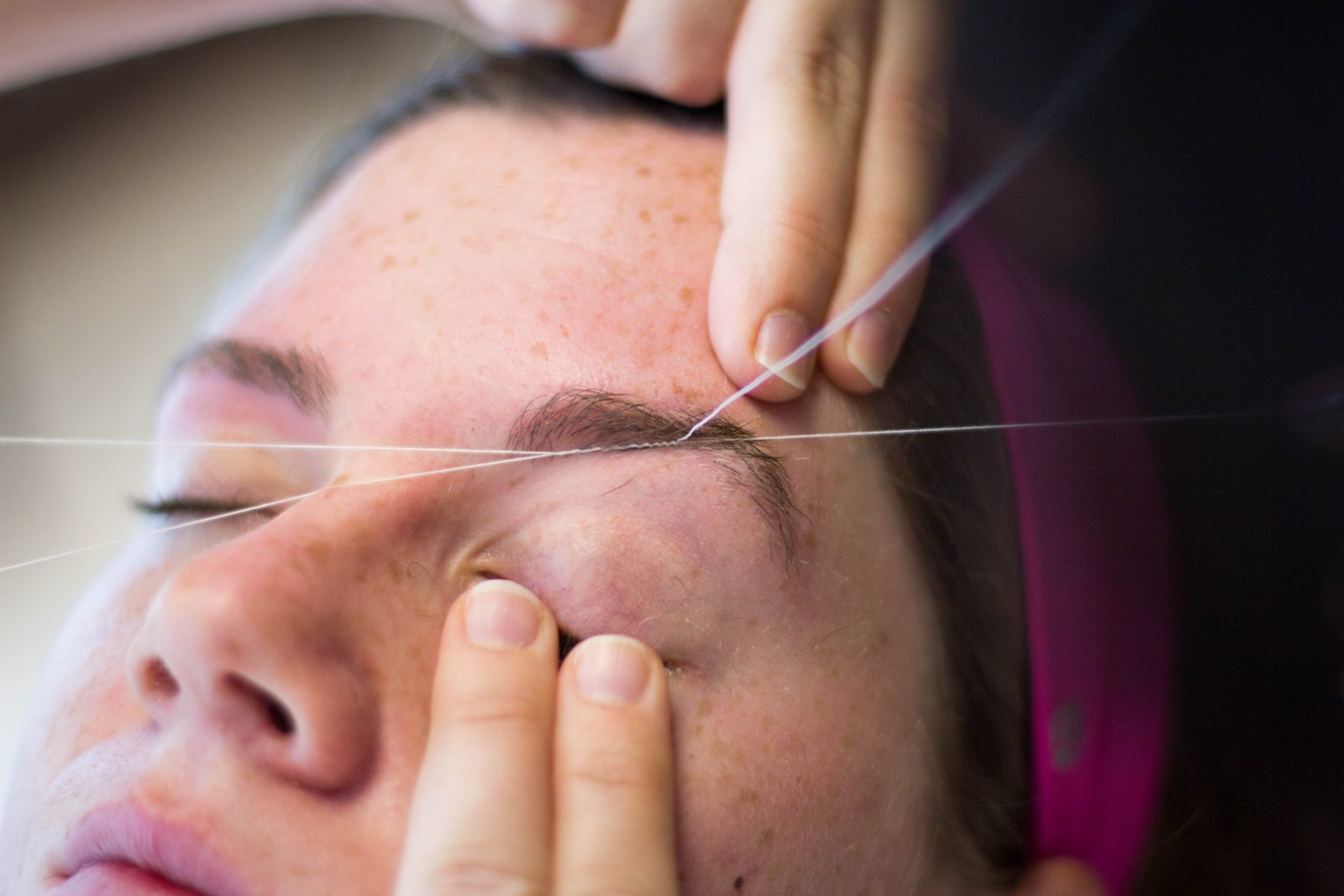 Close-up of eyebrow threading at The Brow Boutique